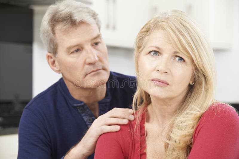 Mature Man Comforting Woman With Depression