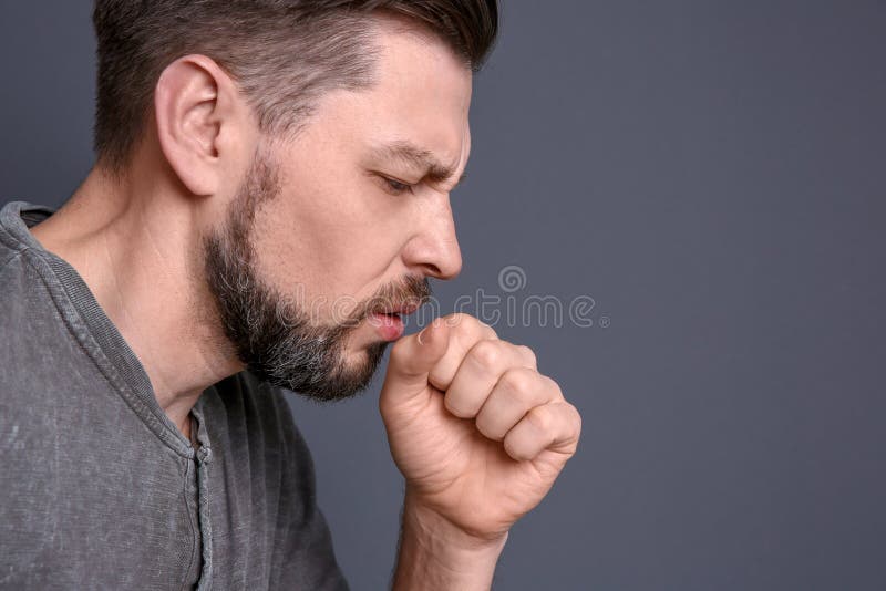 Mature man coughing