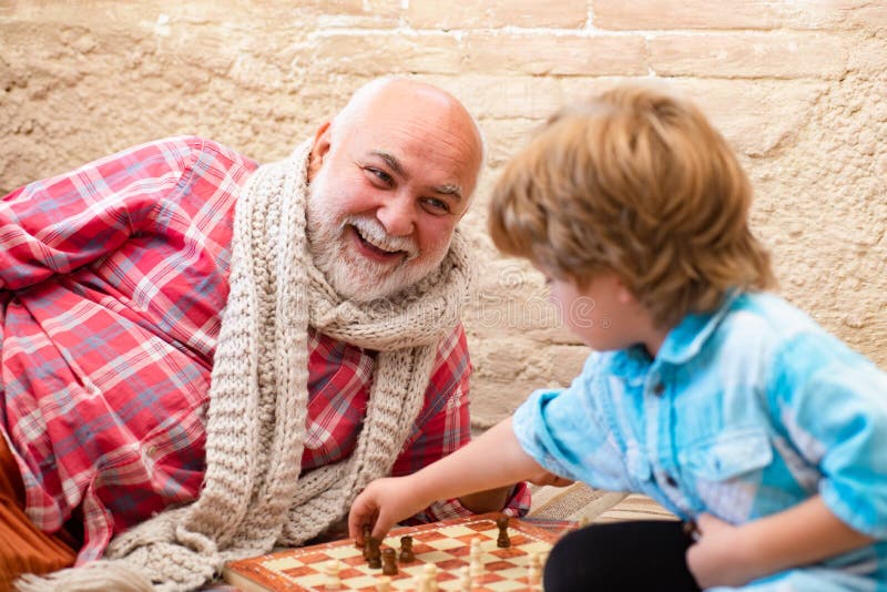 Senior man thinking about his next move in a game of chess Stock Photo by  dmytros9