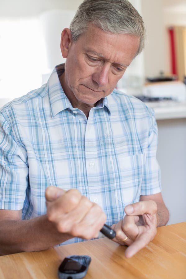 Mature Man Testing Blood Sugar Level at Home Stock Photo Image of