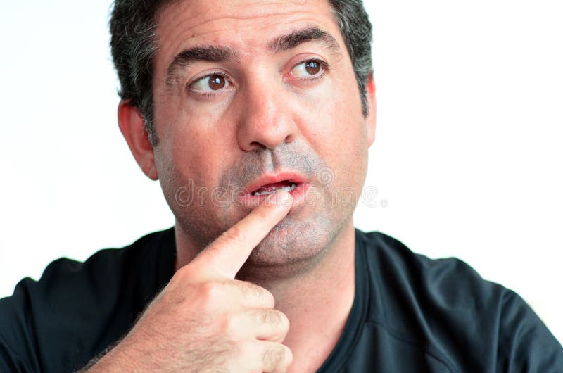 Mature man thinking with one finger on his lips royalty free stock photography Mature man thinking with one finger on his lips royalty free stock photography