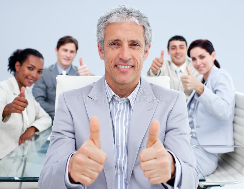 Mature manager celebrating a sucess with his team royalty free stock photos