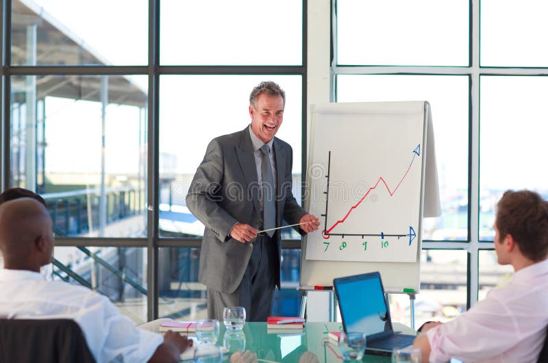 Mature manager speaking in a presentation royalty free stock photo