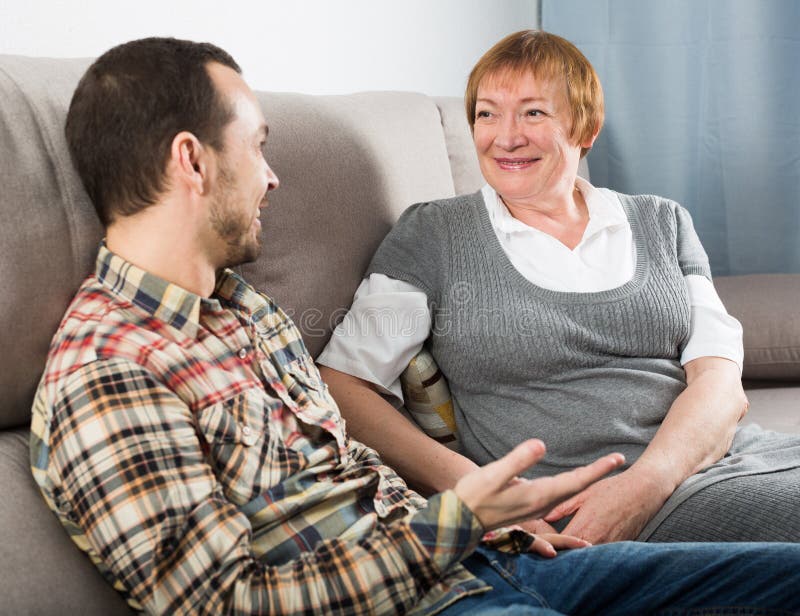 Mature mom and son. Мама и взрослый сын домашка. Мама и взрослый сын в ресторане. Mom son Happy stock photo.