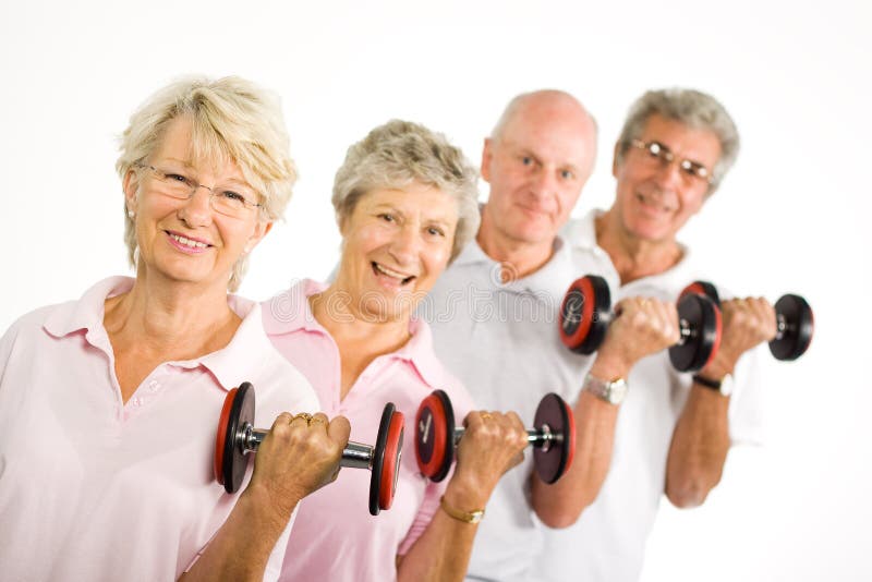 Group of older mature people lifting weights in the gym. Group of older mature people lifting weights in the gym