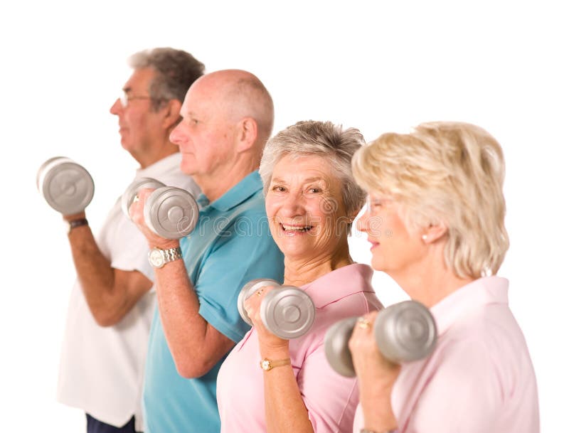 Group of older mature people lifting weights in the gym. Group of older mature people lifting weights in the gym