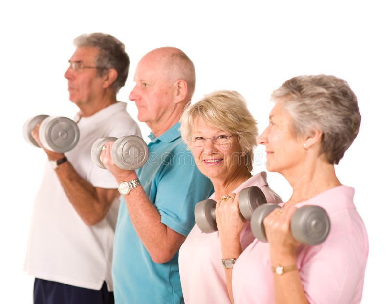 Group of older mature people lifting weights in the gym. Group of older mature people lifting weights in the gym