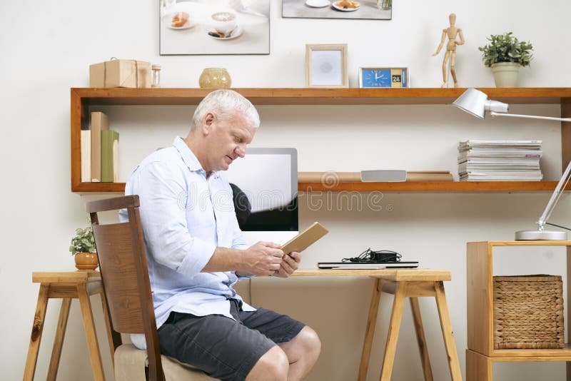Programmer reading requirement specification royalty free stock photography Programmer reading requirement specification royalty free stock photography
