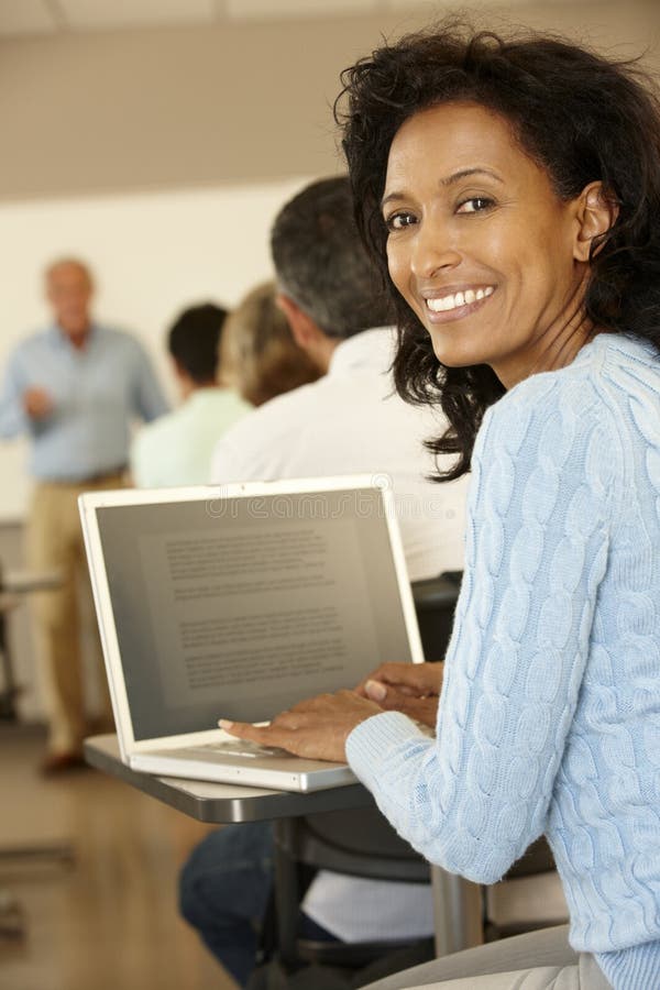 Mature student in class stock image. Image of degree 54962089