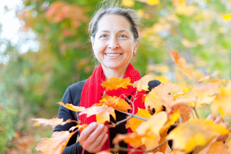 Mature Woman in Autumn with Maple Leaves Stock Image - Image of plant ...