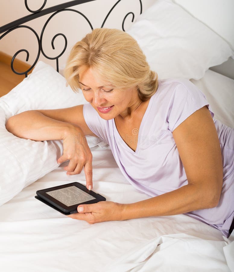 Mature Woman Electronic Book Laying Bed Stock Photos Free Royalty Free Stock Photos From