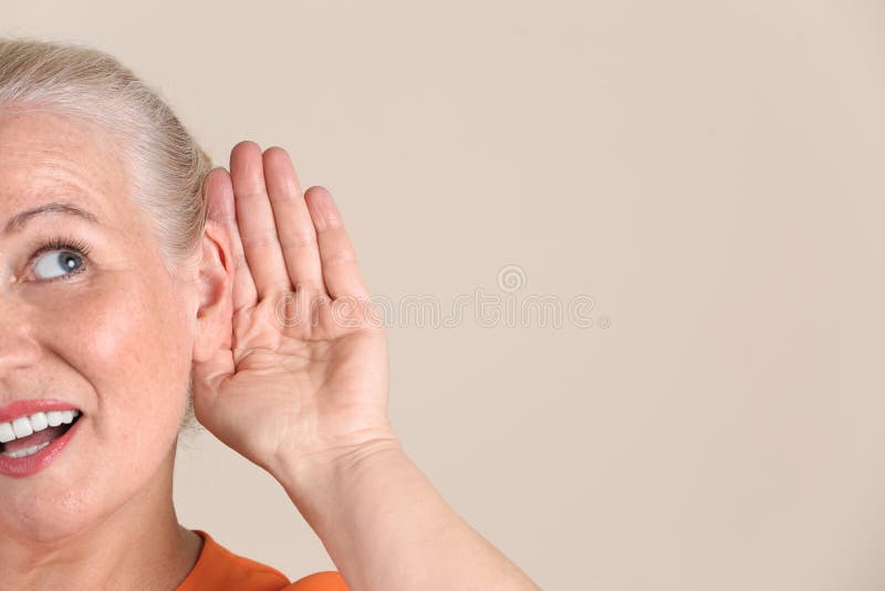 Mature woman with hearing problem stock images Mature woman with hearing problem stock images