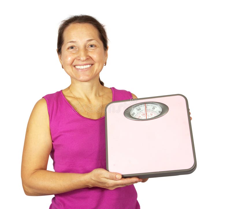 Mature woman holding scale