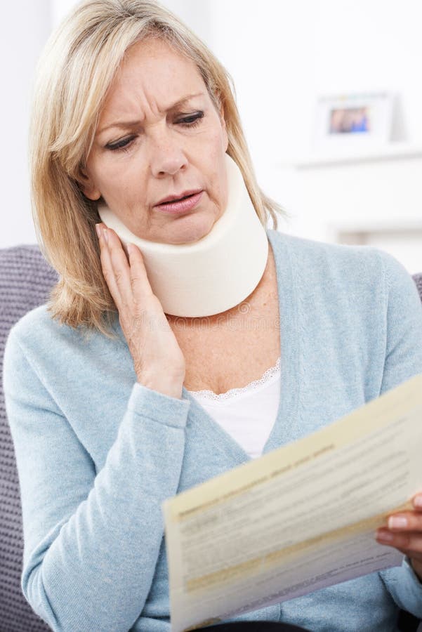 Mature Woman Reading Letter after Receiving Neck Injury Stock Photo ...