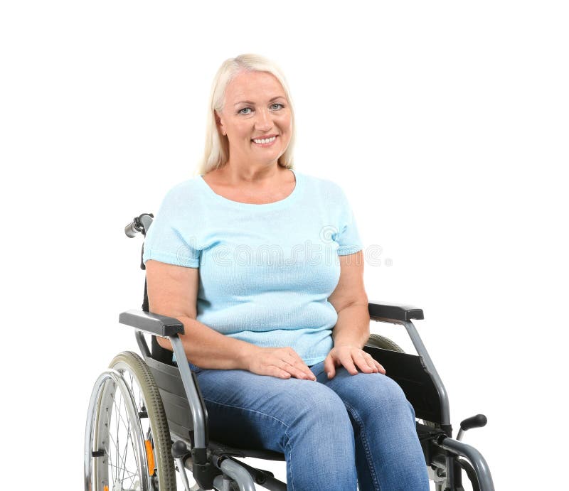 Mature woman talking to senior man on wheelchair stock image