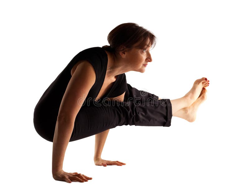 Mature woman stand on hands in yoga pose