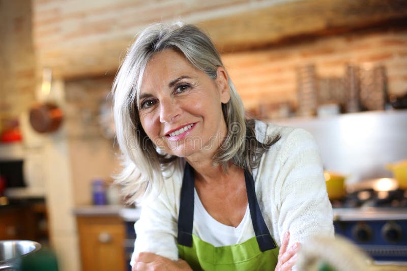 Mature woman standing in kitchen