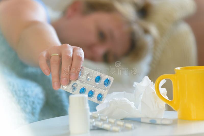 Mature woman suffering from flu or cold stock photo Mature woman suffering from flu or cold stock photo