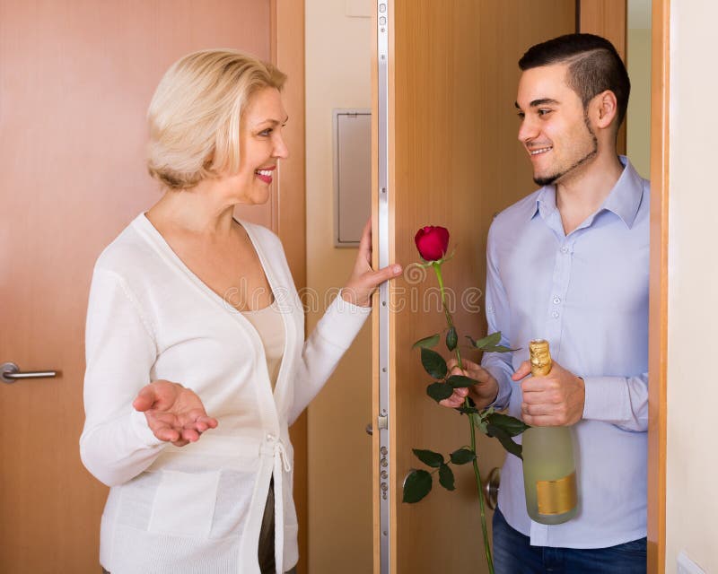 Mature Woman And Young Guy At Doorway Stock Photo Image Of Love