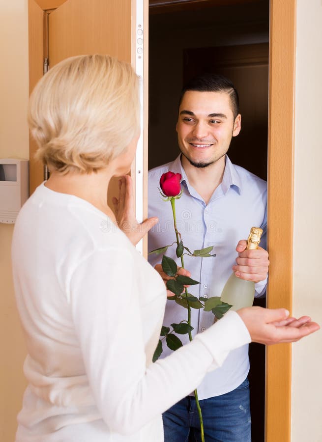 Mature Woman And Young Guy At Door