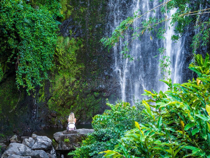 Maui, Hawaii Hana Highway, Sexy blonde girl admires Wailua Falls, near Lihue, Kauai. Road to Hana connects Kahului to the town of Hana Over 59 bridges, 620 curves, tropical rainforest. Maui, Hawaii Hana Highway, Sexy blonde girl admires Wailua Falls, near Lihue, Kauai. Road to Hana connects Kahului to the town of Hana Over 59 bridges, 620 curves, tropical rainforest.