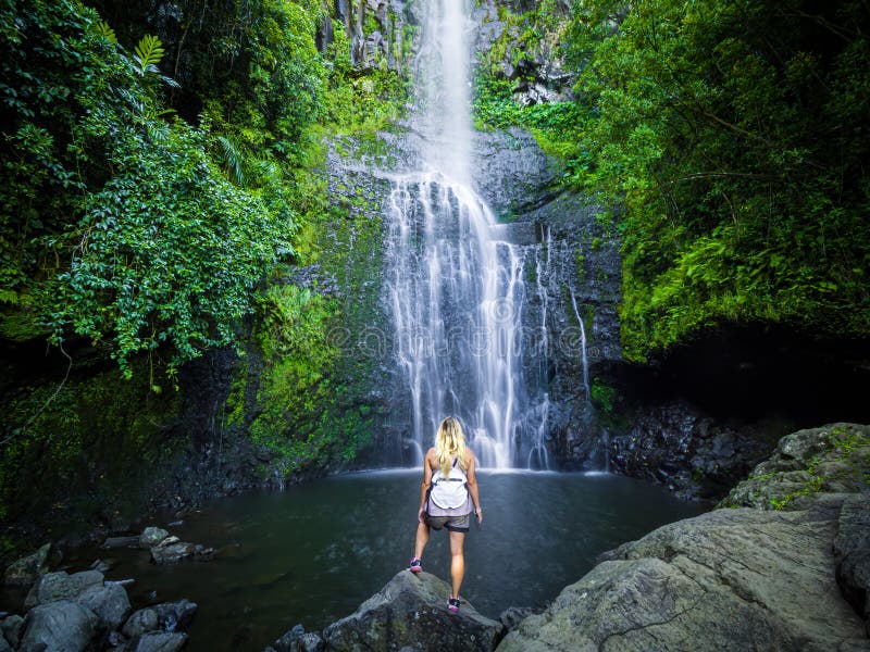 Maui, Hawaii Hana Highway, Sexy blonde girl admires Wailua Falls, near Lihue, Kauai. Road to Hana connects Kahului to the town of Hana Over 59 bridges, 620 curves, tropical rainforest. Maui, Hawaii Hana Highway, Sexy blonde girl admires Wailua Falls, near Lihue, Kauai. Road to Hana connects Kahului to the town of Hana Over 59 bridges, 620 curves, tropical rainforest.