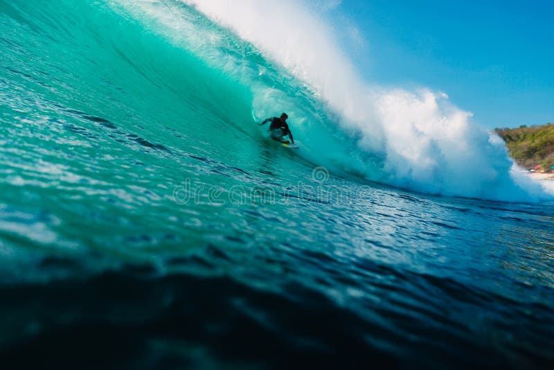 May 12, 2021. Bali, Indonesia. Surfer Ride on Surfboard at Big Barrel