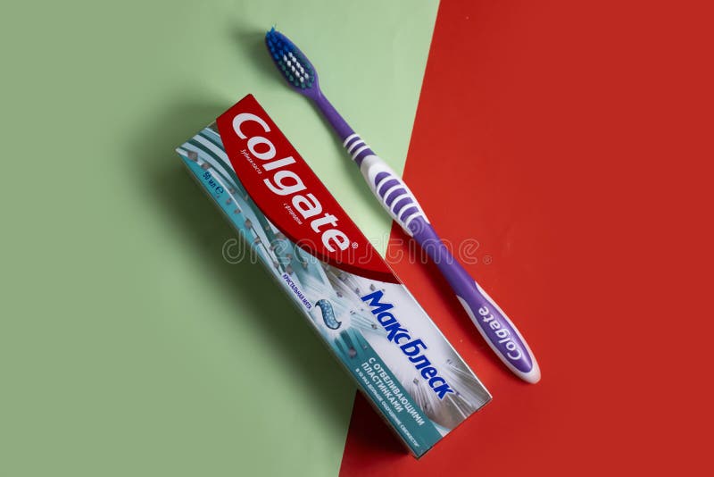 May 22, 2022 Ukraine City Kyiv Colgate Tube Teeth Toothpaste on a Colored Background Editorial