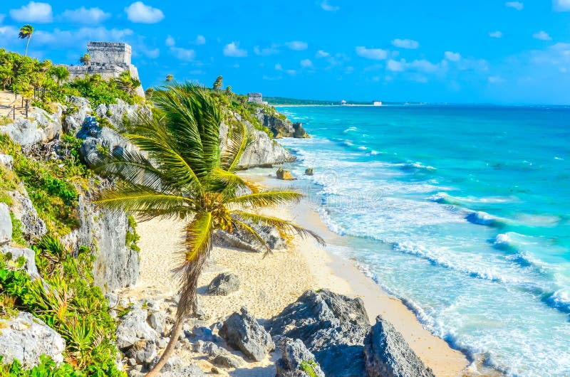 Mayan ruins of Tulum at tropical coast. El Castillo Temple at paradise beach. Mayan ruins of Tulum, Quintana Roo, Mexico