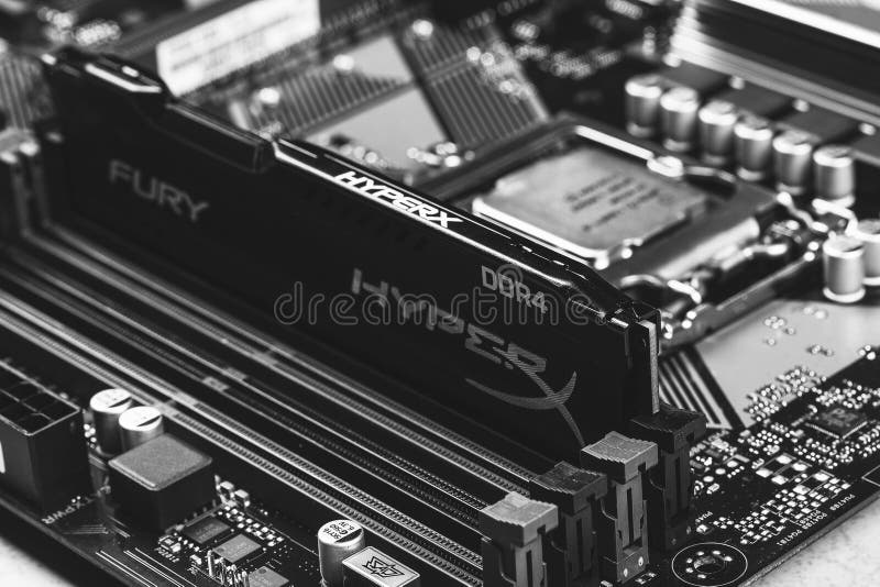 Black DDR 4 DIMM 16 Gb Kingston HyperX Fury Memory RAM Module in the slot on the motherboard Asus closeup, black and white photogr royalty free stock image Black DDR 4 DIMM 16 Gb Kingston HyperX Fury Memory RAM Module in the slot on the motherboard Asus closeup, black and white photogr royalty free stock image