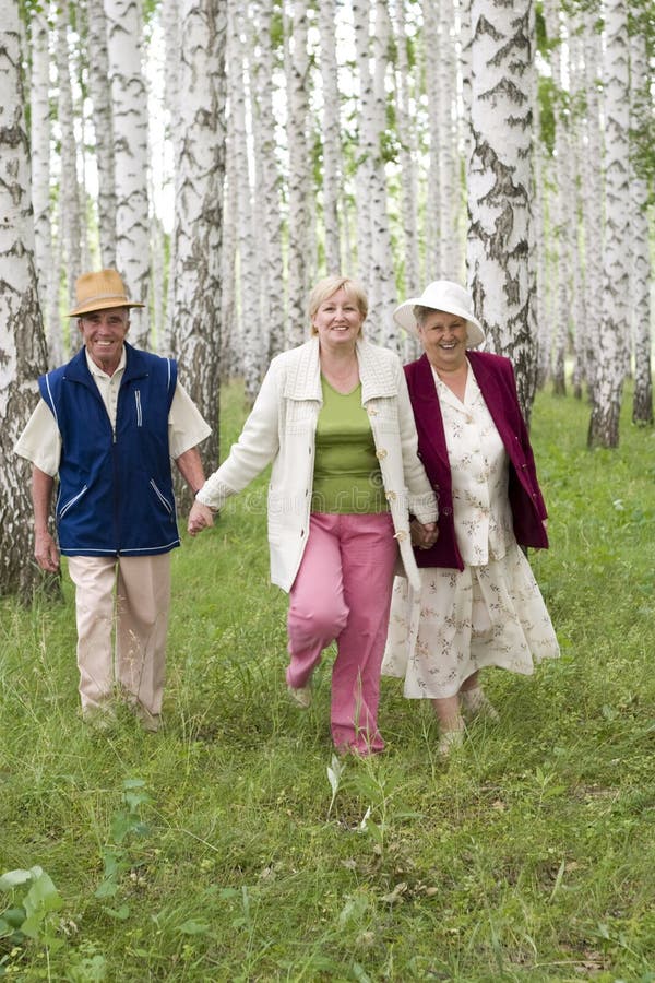 Seniors - father, daughter and mother - happy family. Seniors - father, daughter and mother - happy family