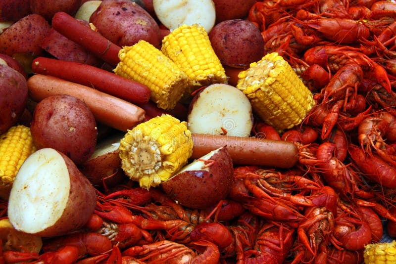 Boiled crawfish with corn, potatoes and hot dogs. Boiled crawfish with corn, potatoes and hot dogs.