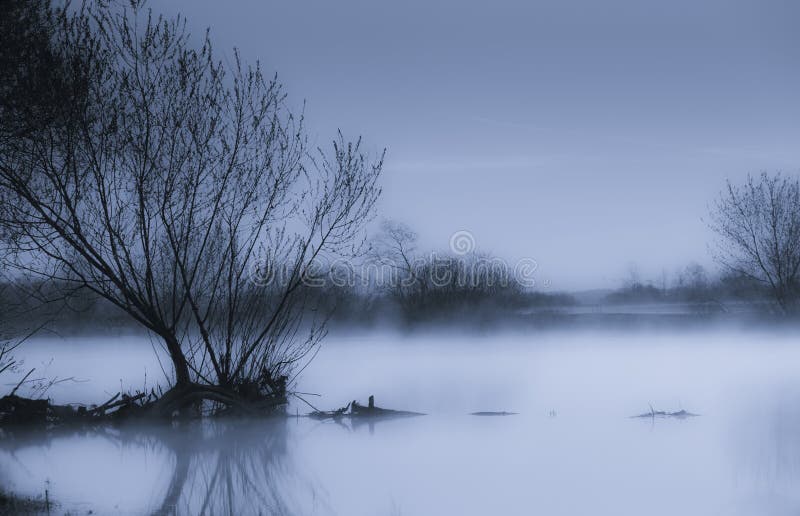 Fog at waterside in early morning. Foggy scene. Fog at waterside in early morning. Foggy scene.