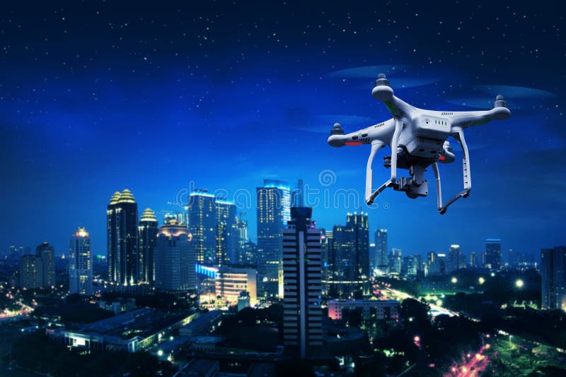 Small white drone flying over the city. Small white drone flying over the city