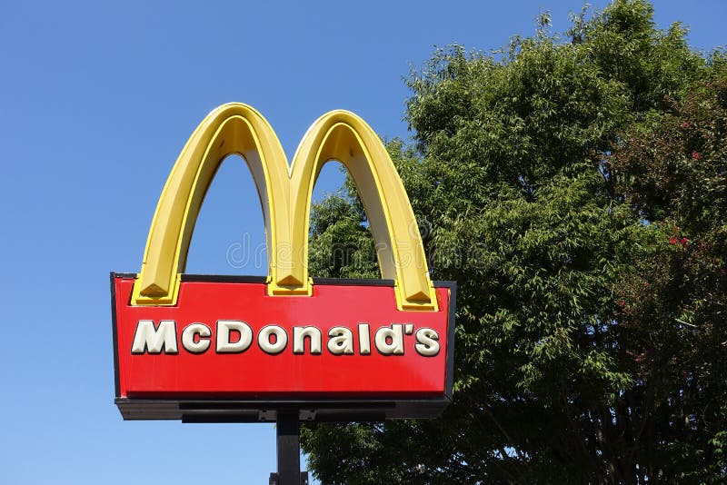 McDonald`s Golden Arches Signage Outside the Fast Food Restaurant