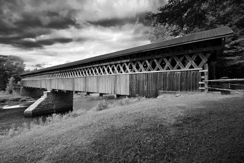 McVetty-McKenzie covered bridge made of wood and dating from 1893 is located in Gould, Lingwick, Estrie, Quebec Canada black and. McVetty-McKenzie covered bridge royalty free stock photos McVetty-McKenzie covered bridge made of wood and dating from 1893 is located in Gould, Lingwick, Estrie, Quebec Canada black and. McVetty-McKenzie covered bridge royalty free stock photos