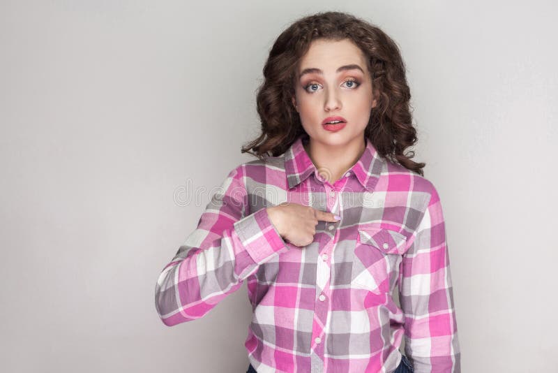 Is it me? Surprised beautiful girl with pink checkered shirt, cu stock photos Is it me? Surprised beautiful girl with pink checkered shirt, cu stock photos