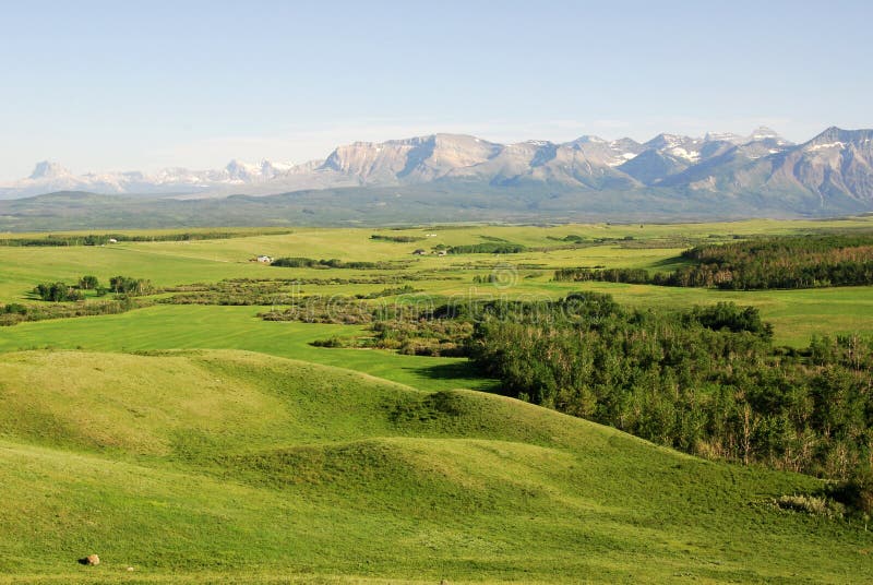 Meadows, forests and mountains stock photography