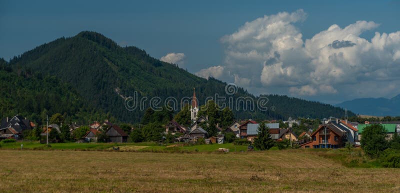 Meadows and hills near Liptovska Porubka village in summer hot day