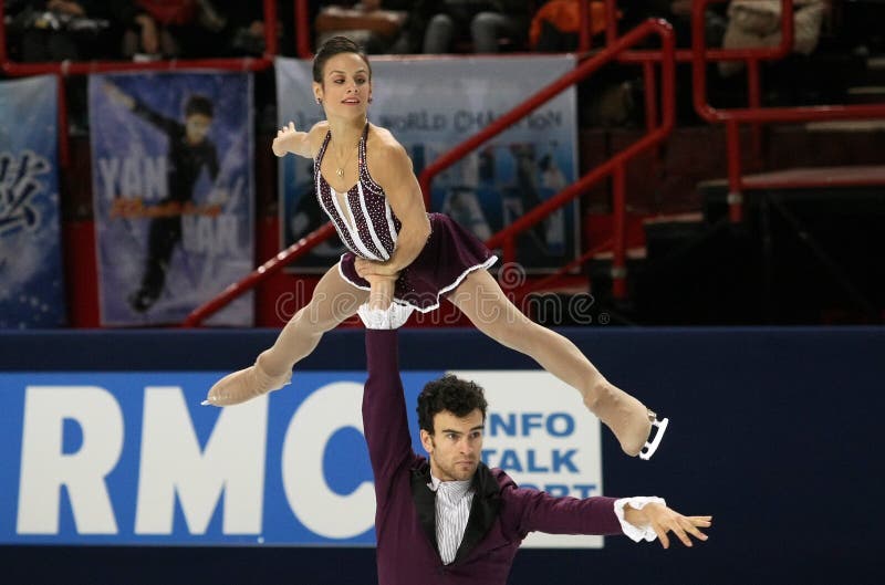 Meagan DUHAMEL / Eric RADFORD (CAN). PARIS, FRANCE - NOVEMBER 16, 2013: Meagan DUHAMEL / Eric RADFORD of Canada perform free program at Trophee Bompard ISU Grand stock image