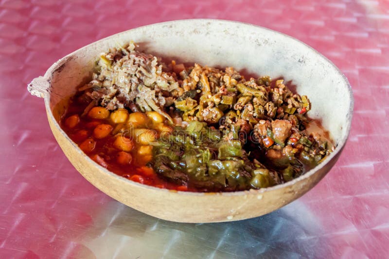 Meal in Guyana. Meal consisting of beans, vegetables and achar, served in calabash. Georgetown, capital of Guyana stock photography Meal in Guyana. Meal consisting of beans, vegetables and achar, served in calabash. Georgetown, capital of Guyana stock photography