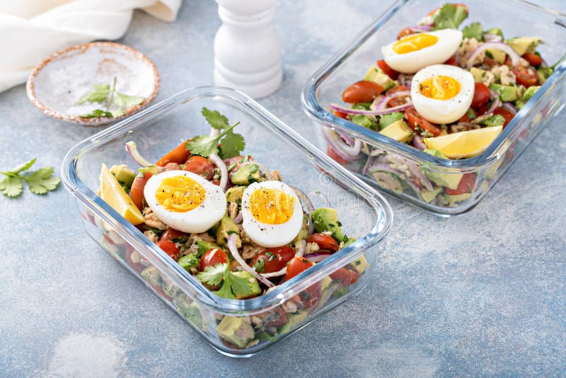 Meal Prep Containers with Avocado Tuna Salad and Boiled Egg Stock Photo