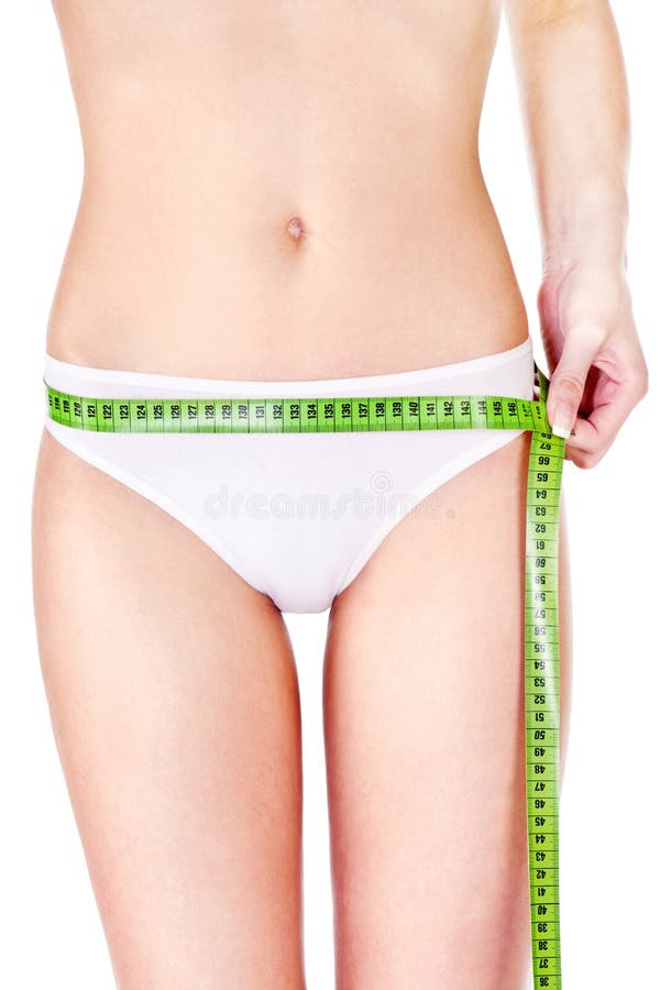 Measure tape around slim woman s hip
