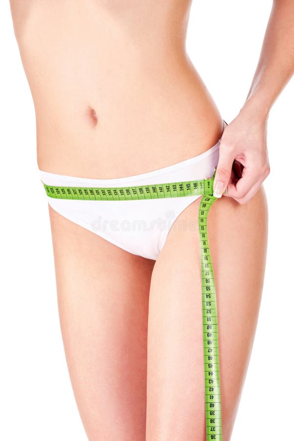 Measure tape around slim woman s hip