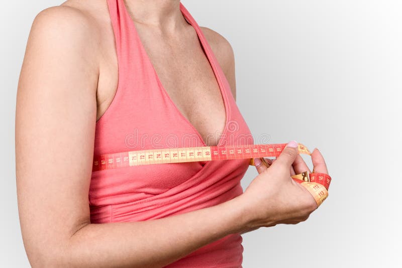 Woman measuring her breast size Stock Photo by ©wacpan 3994258