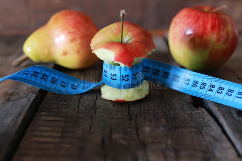 Measurement red bitten apple. Measure, dieting.