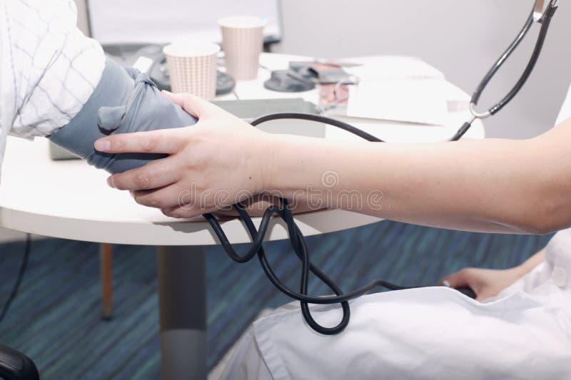 Measuring blood pressure stock photos