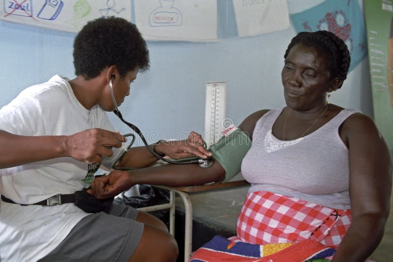 Measuring blood pressure, older women, doctor