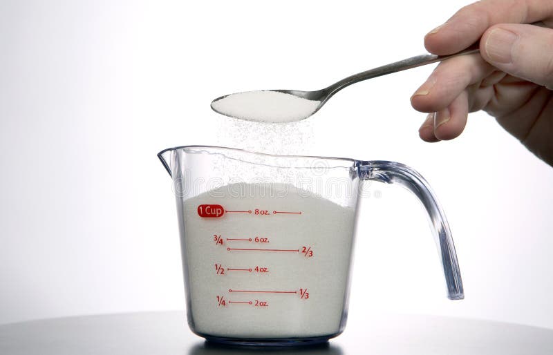 Measuring A Cup Of Sugar stock image