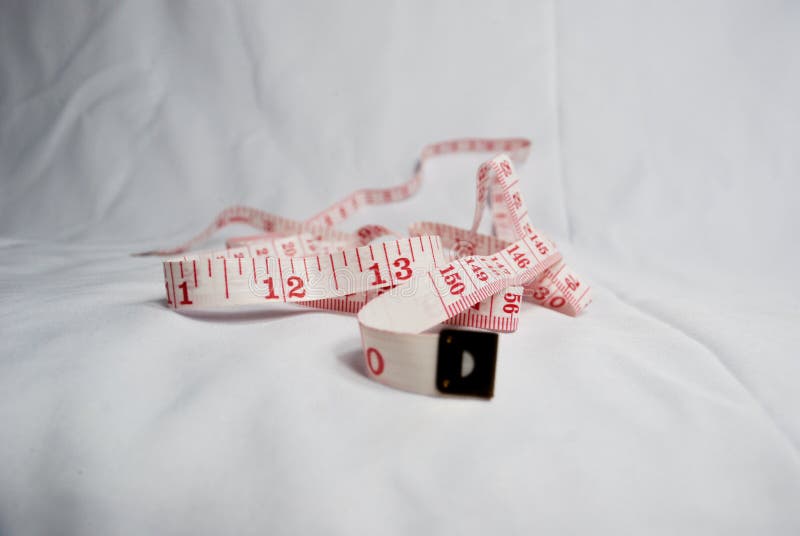 Measuring lint with red numbers on white background